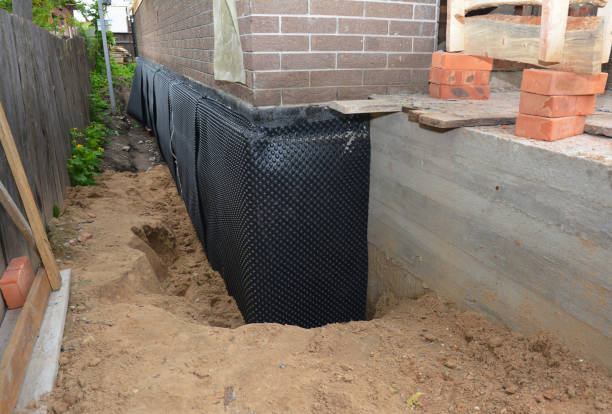 Happy homeowners after waterproofing job in Hewlett